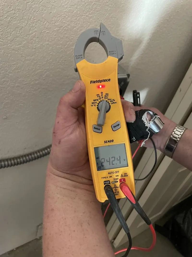 Voltage testing with clamp meter during Electrical Installation Services in Pontoon Beach